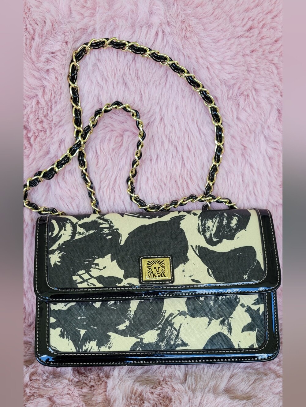 Anne Klein handbag  a black and beige floral print and a gold-toned Chain